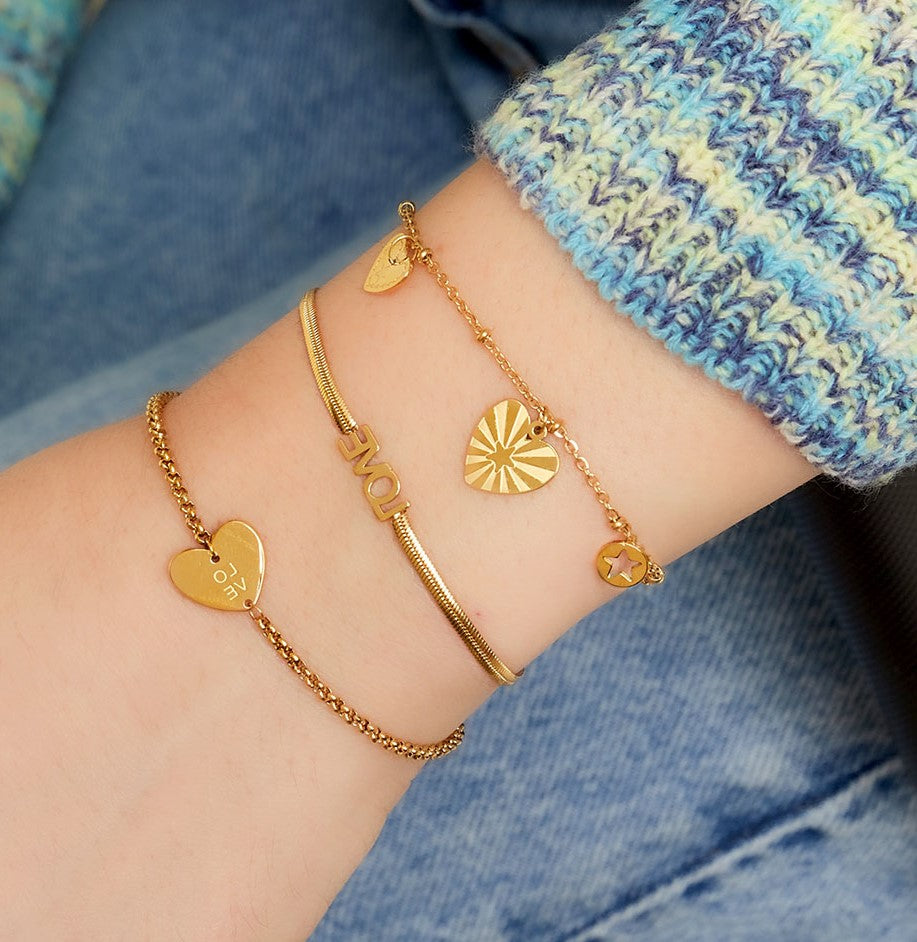 Armband | Hartvormige hangers en ster goud