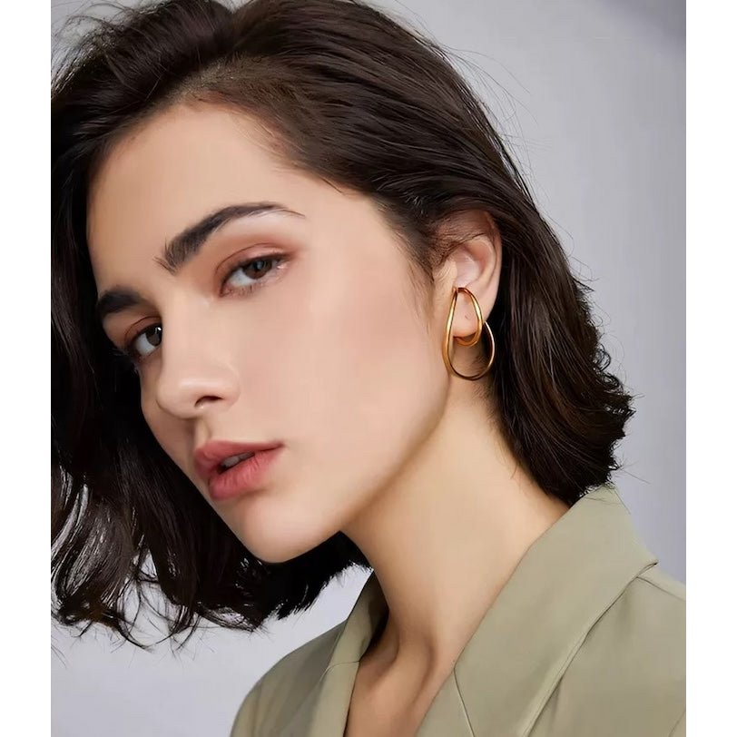 Geometric 3D ear cuffs with flowing lines, one pair