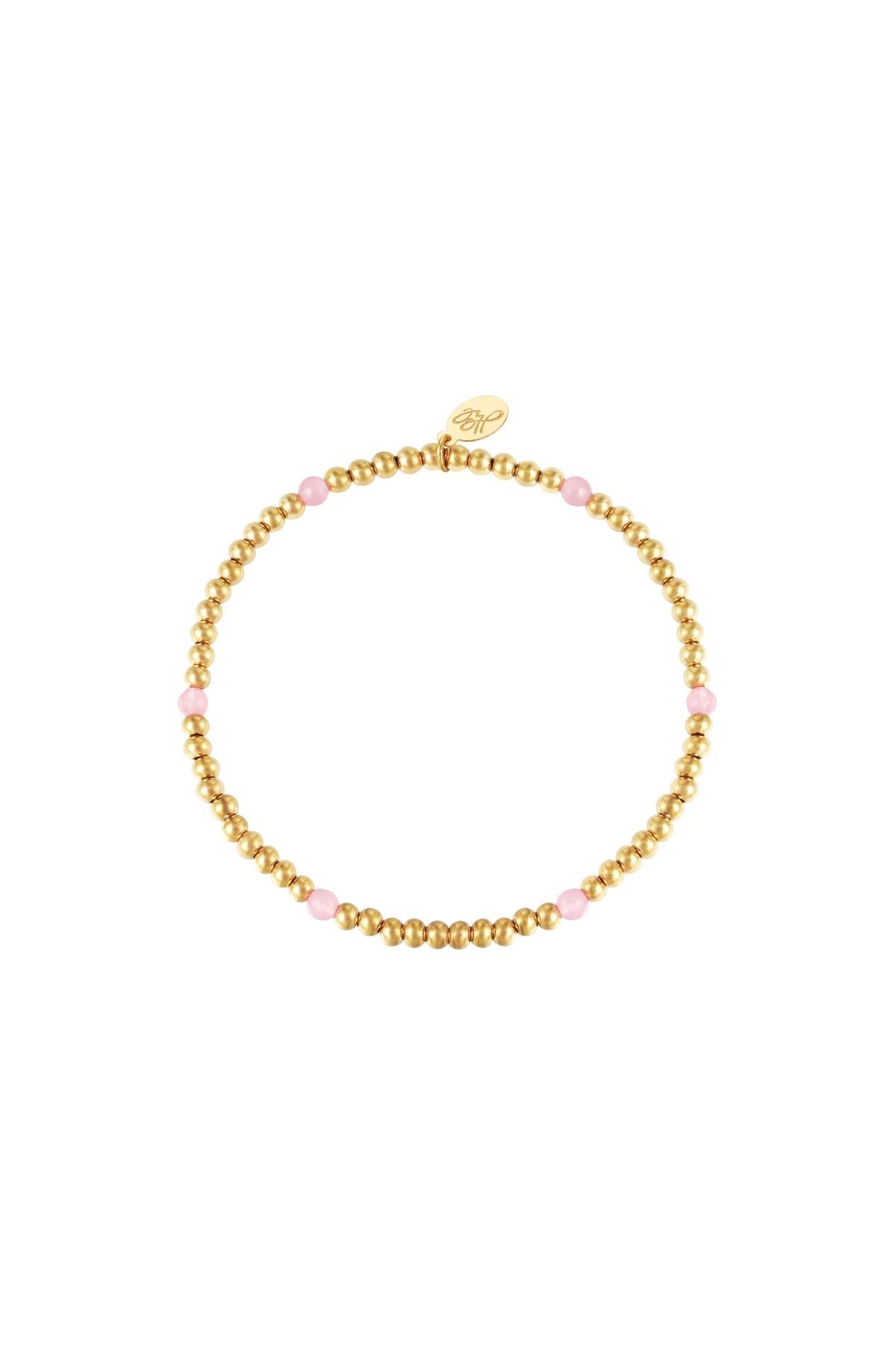 Armband | Gouden armbandje met roze kraaltjes