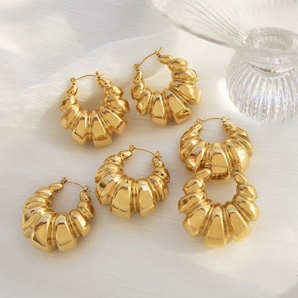 Thick croissant shaped large hoop earrings