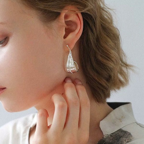 Modern silver curved leaf earrings