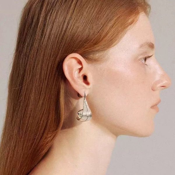 Modern silver curved leaf earrings