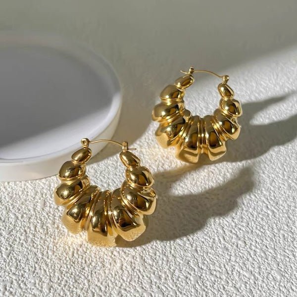Thick croissant shaped large hoop earrings