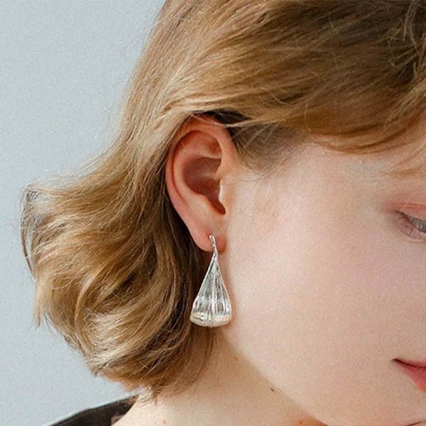 Modern silver curved leaf earrings